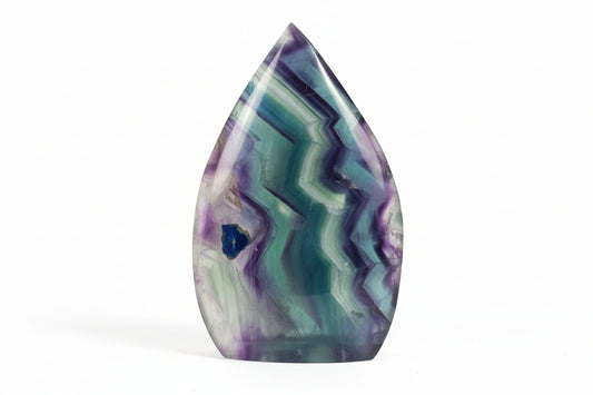 Teardrop-shaped Rainbow Fluorite crystal with small blue druzy pocket (back)